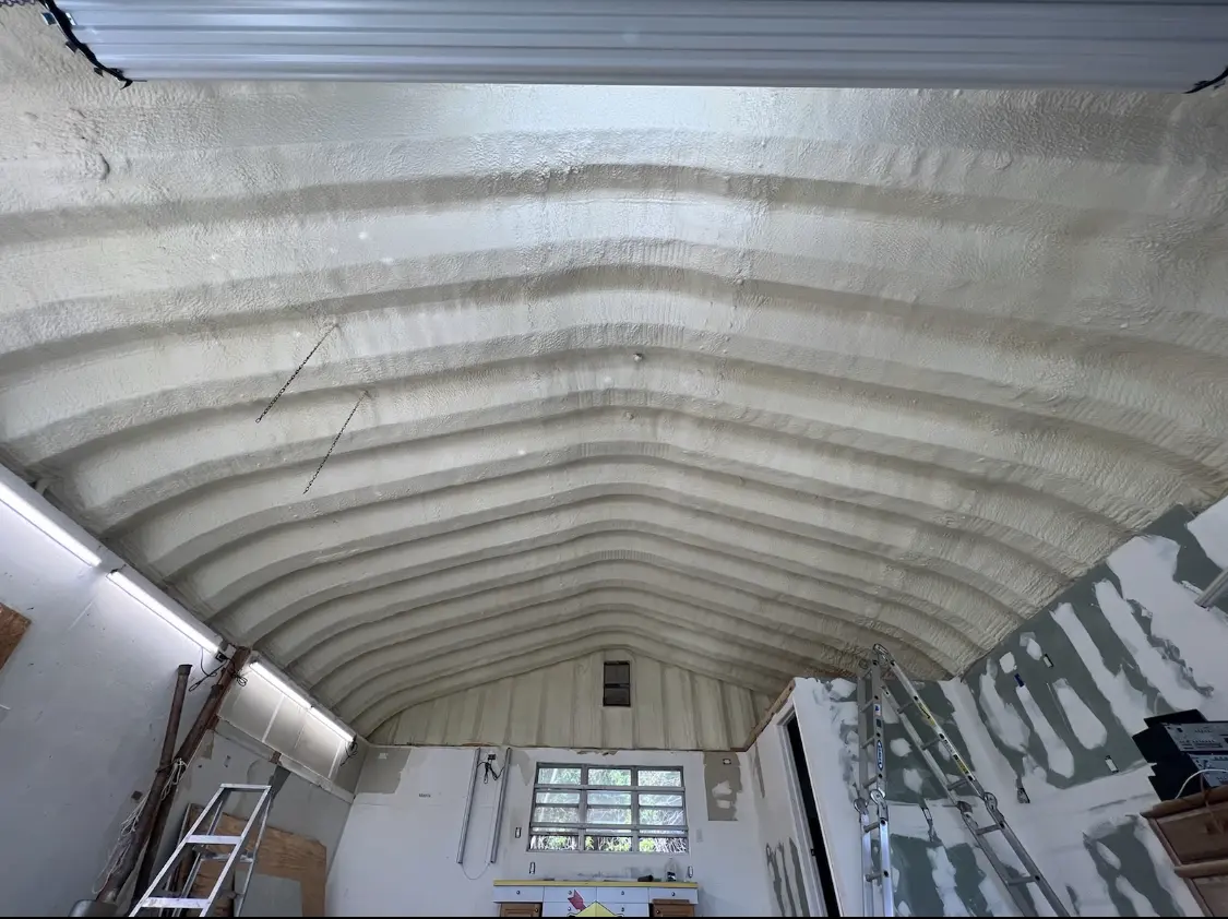Spray polyurethane foam applied to the underside of a metal roof deck in Woods Cross
